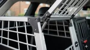 A close-up illustration of the smooth gas-strut door opening mechanism on the Thule Allax dog crate.