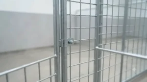 Detailed view of strong welded wire mesh panels on a budget outdoor dog kennel.