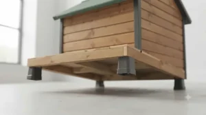 Underside view of an apex roof dog kennel showing feet that raise the timber floor off damp ground.
